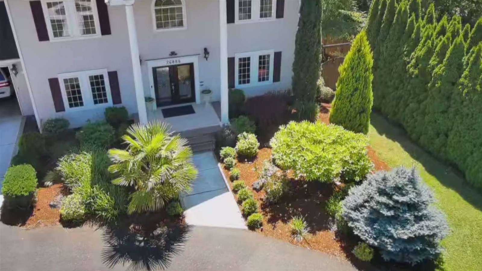 Front entry with planted beds and a clean walkway