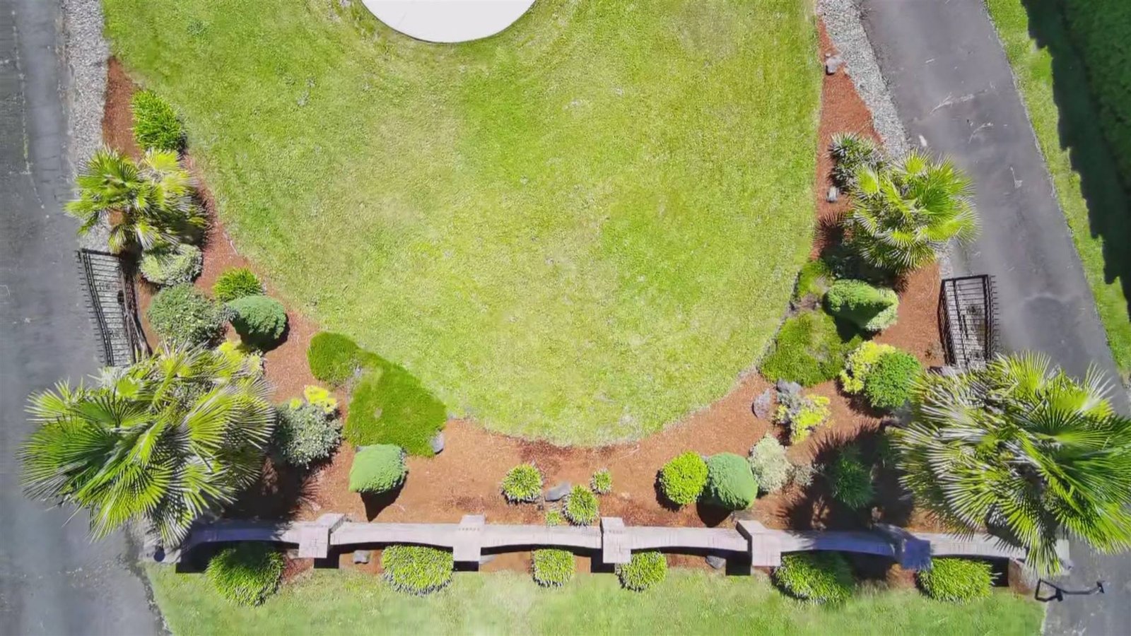 The curved beds and lawn seen straight down