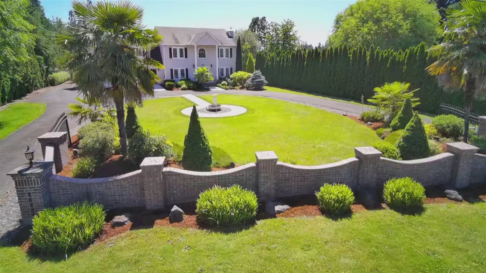Landscaped grounds with walled beds and a manicured lawn