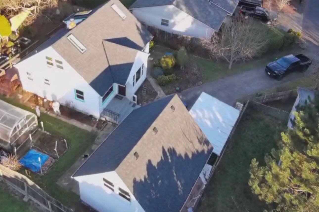 The house and detached garage, both with new roofs