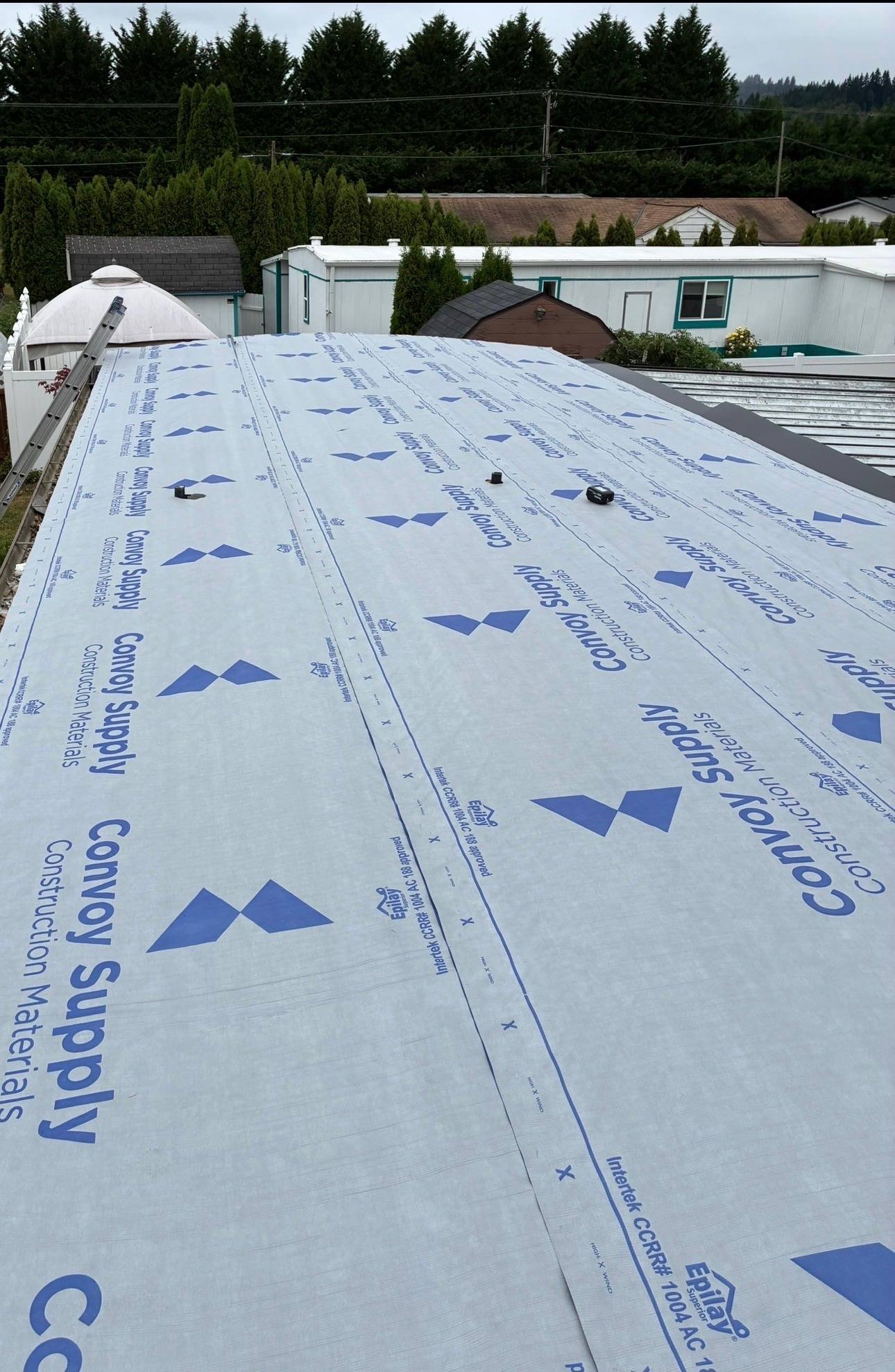Synthetic underlayment covering the new deck