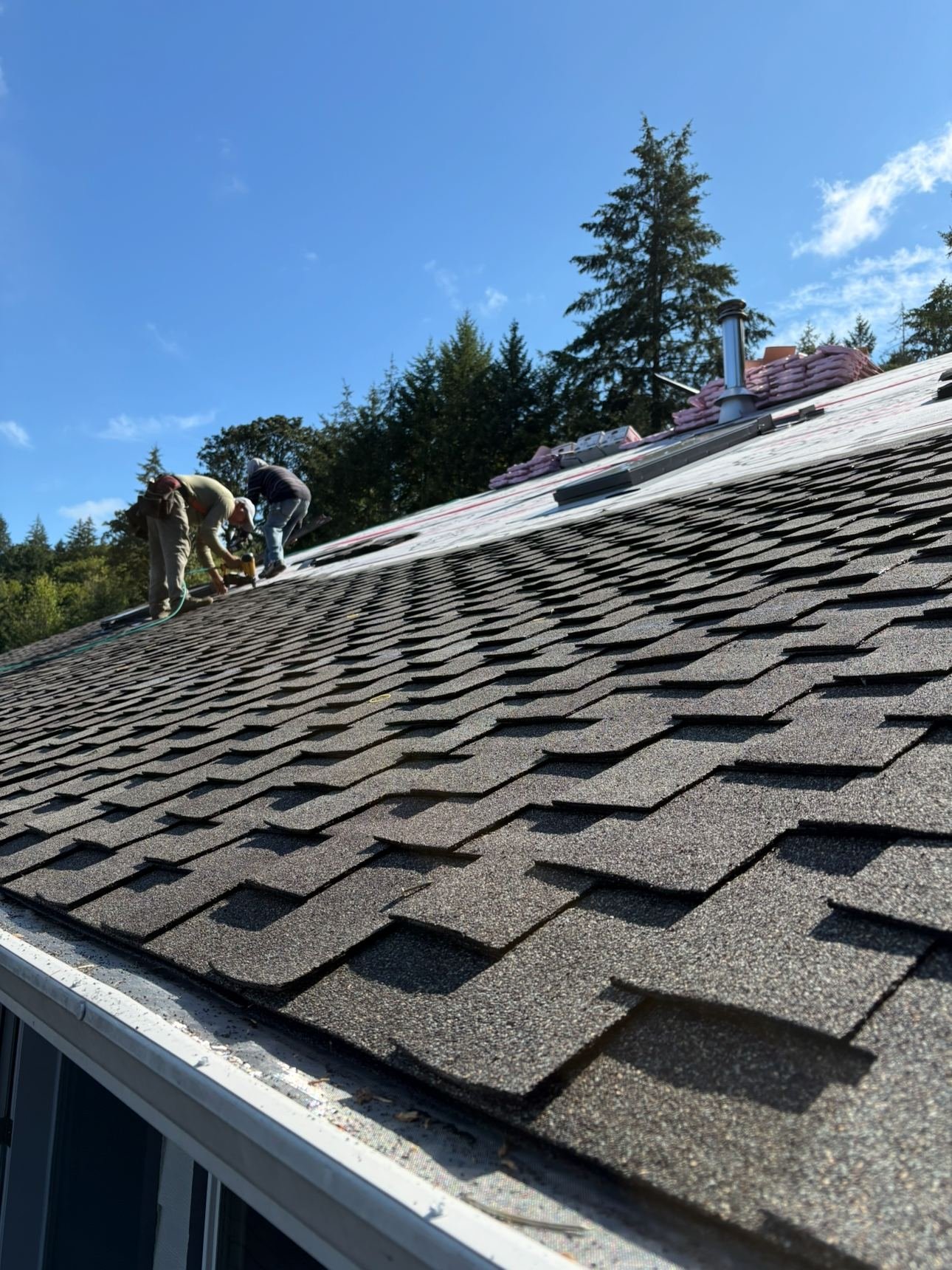 New shingles and the gutter line up close